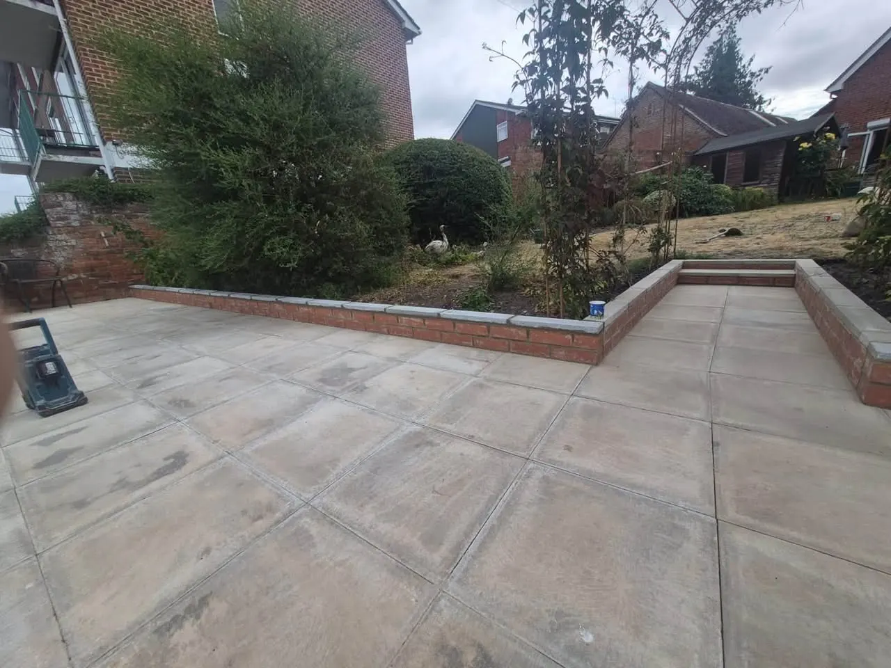 Completed patio with brick retaining wall